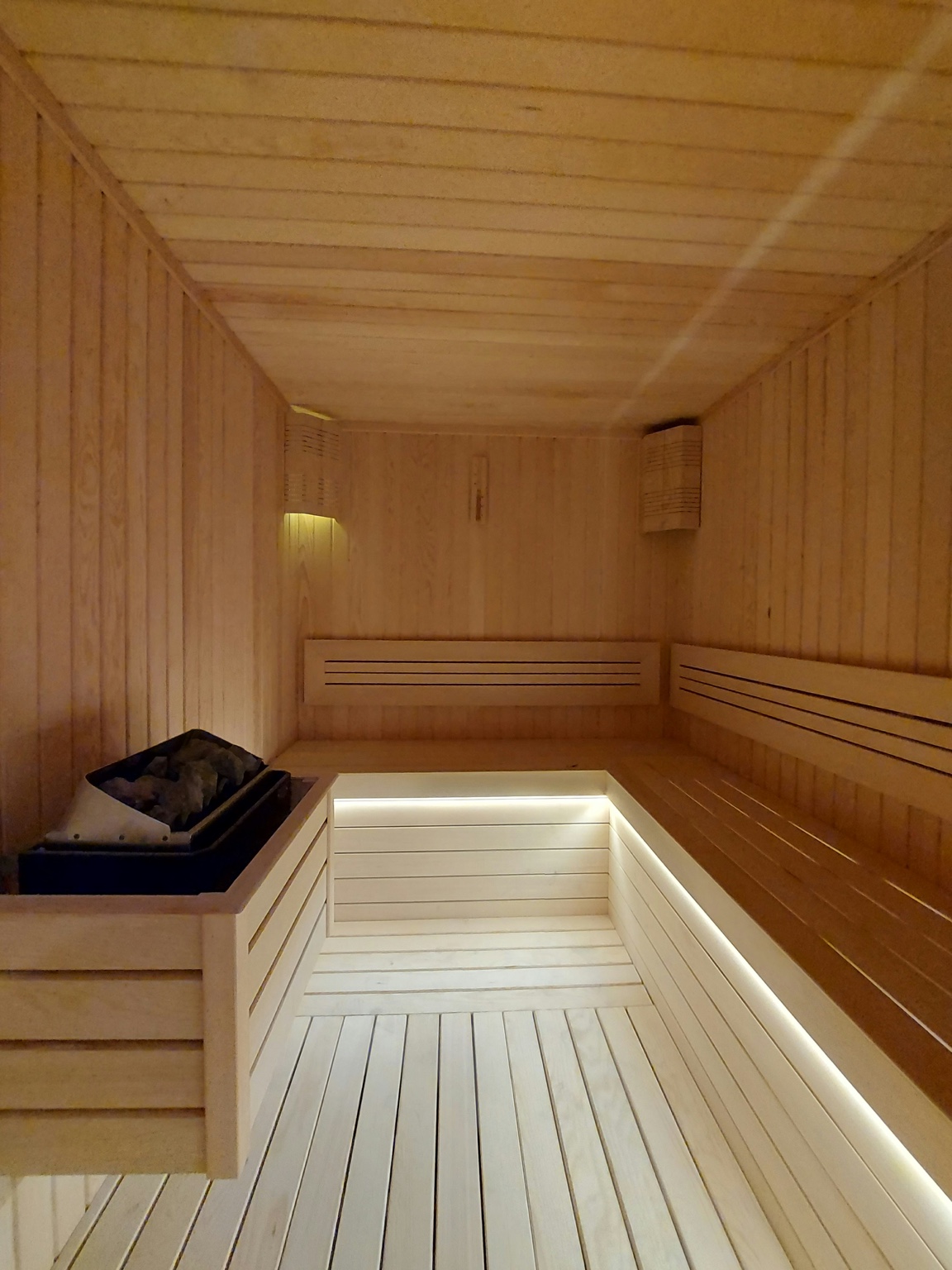 Sauna interior with benches and heater